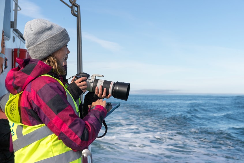 Researcher on board Sylvia, traditional whale watching tour from Husavik, Iceland