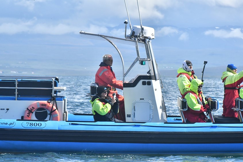 Guide Dimitra photographing whale flukes, Skjalfandi Bay