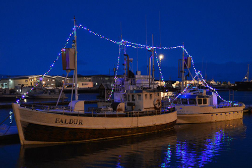 GG boats decorated with Christmas lights.
