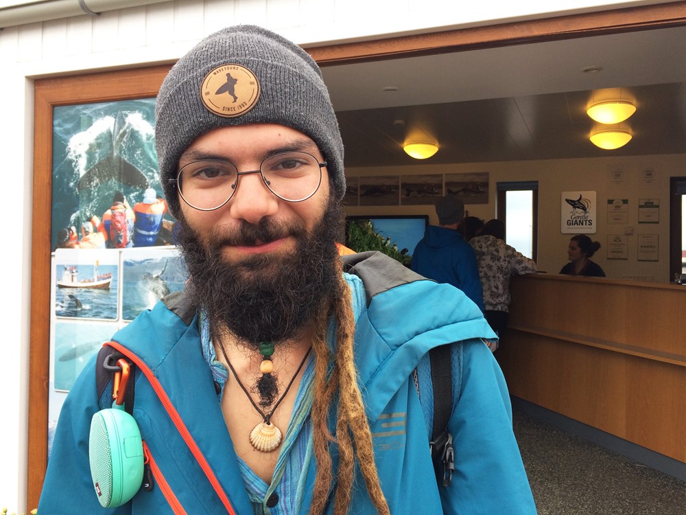 Mert Gültekin, the young artist who travels without money and sold his art to pay whale watching ticket in Húsavík with Gentle Giants.