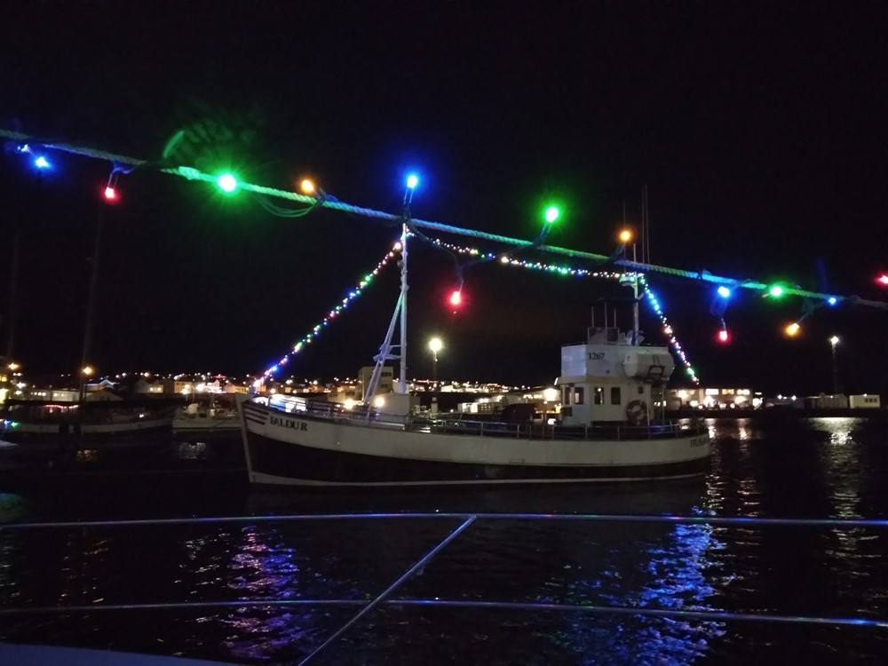 Christmas lights on whale watching boats from Húsavík